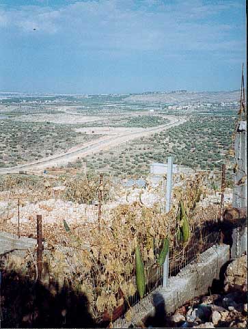 The fence at Jayyus can be seen snaking into the distance through the countryside, preventing the villagers from reaching their farm land.